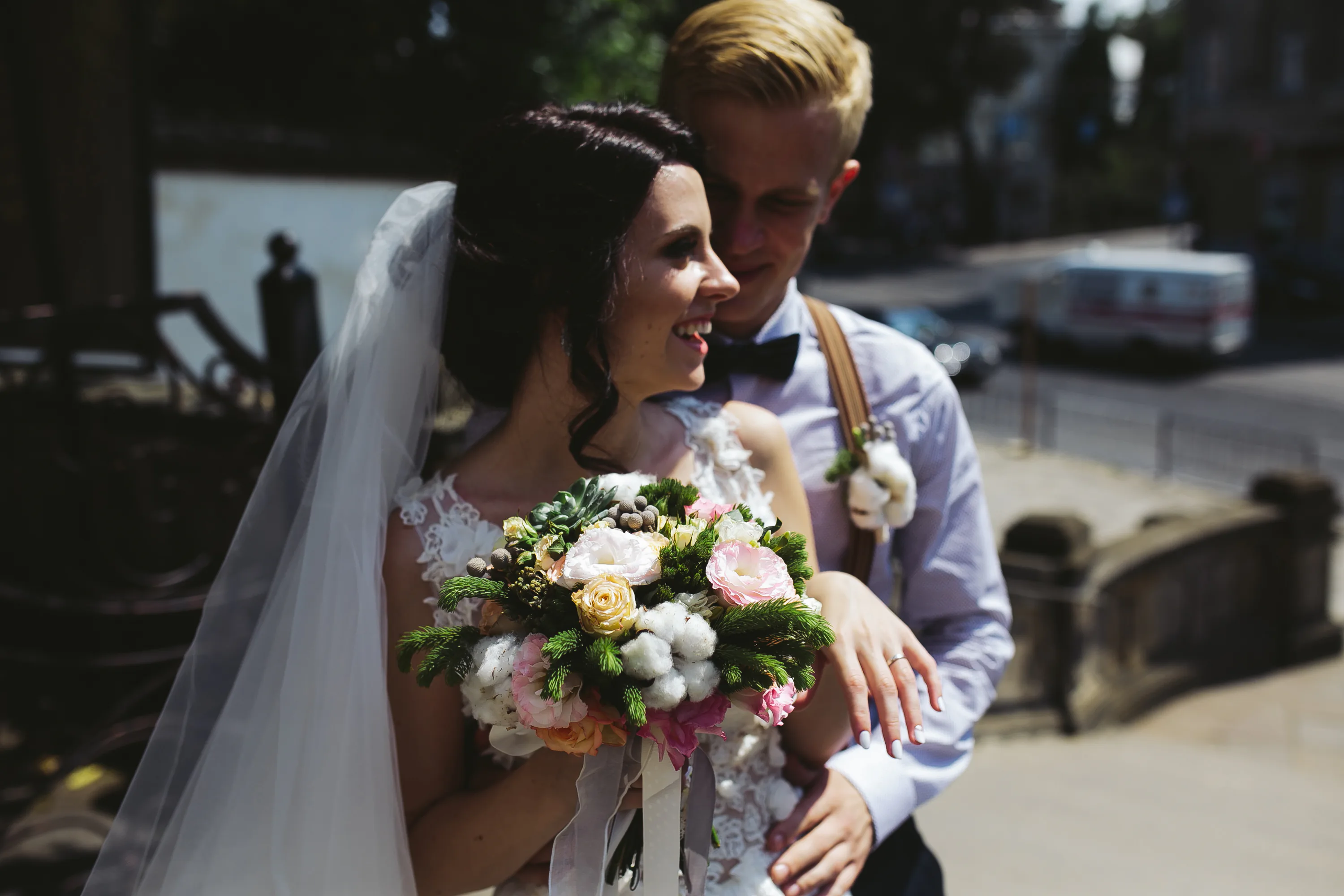 Groom hugging his wife