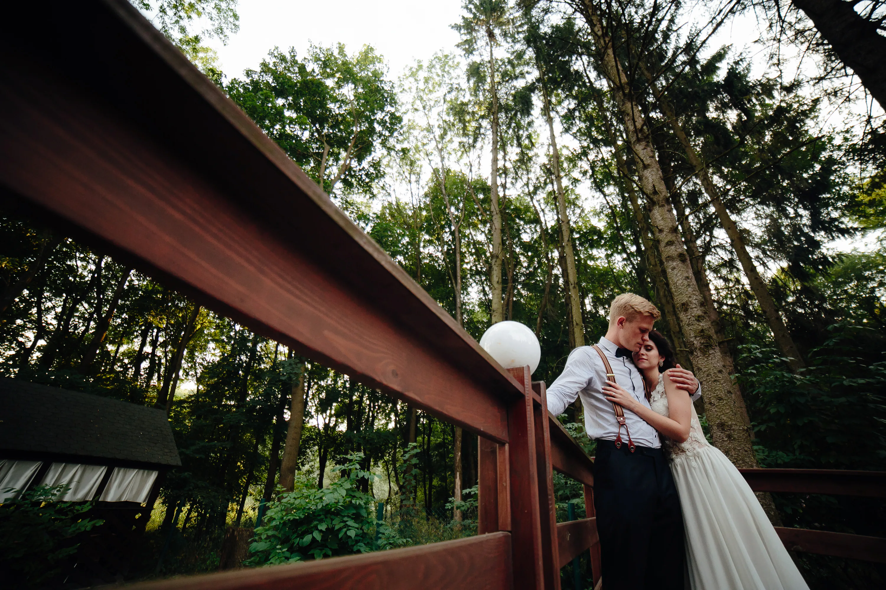 Couple embracing on a bridge
